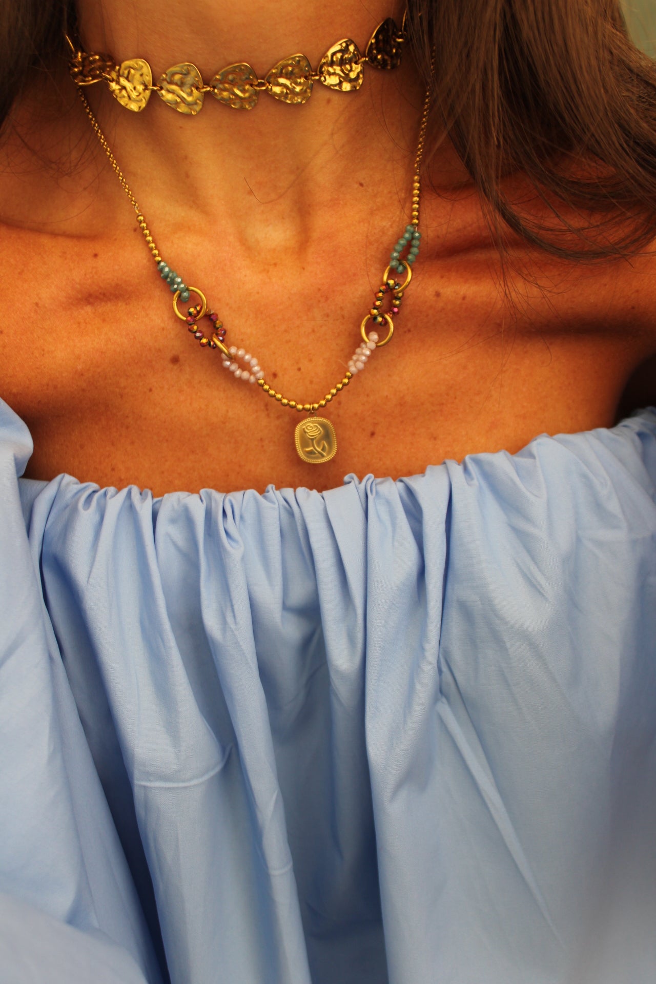 Necklace featuring a rose pendant