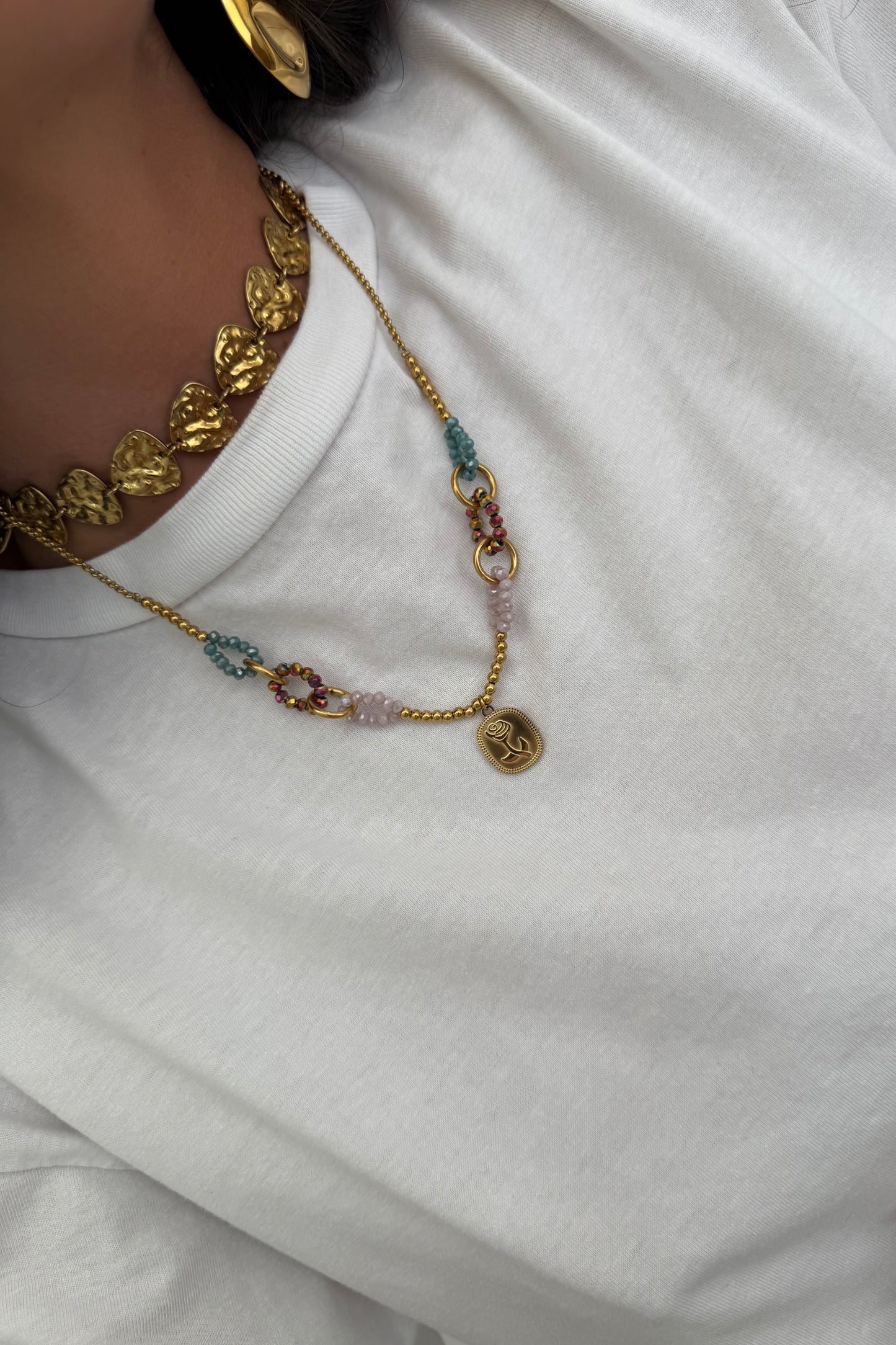 Necklace featuring a rose pendant
