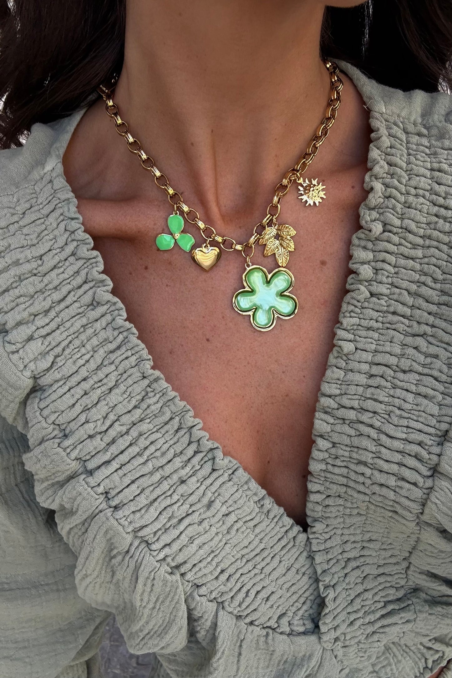 Necklace with green-toned charms