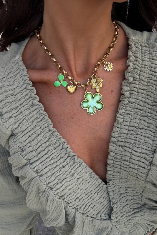 Necklace with green-toned charms